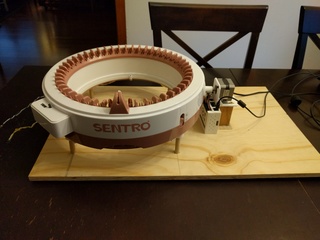 Sentro 48-hook knitting machine mounted on a wooden board